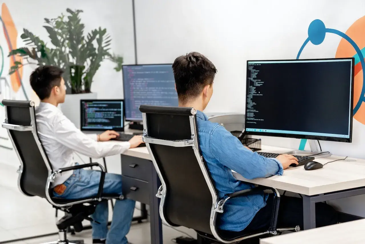Programmers writing code on their computers